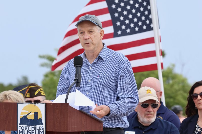 Bill Szymczak speaks in honor of his father, William, who served on the Navy destroyer USS Corry that shelled Omaha Beach June 6, 1944. The ship was sunk by German guns during the invasion.